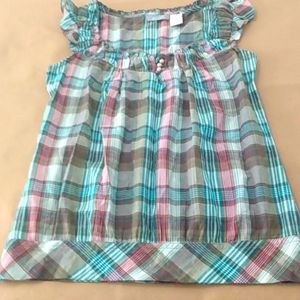 Top madris plaid ruffle neckline & shoulder, three pearl button front